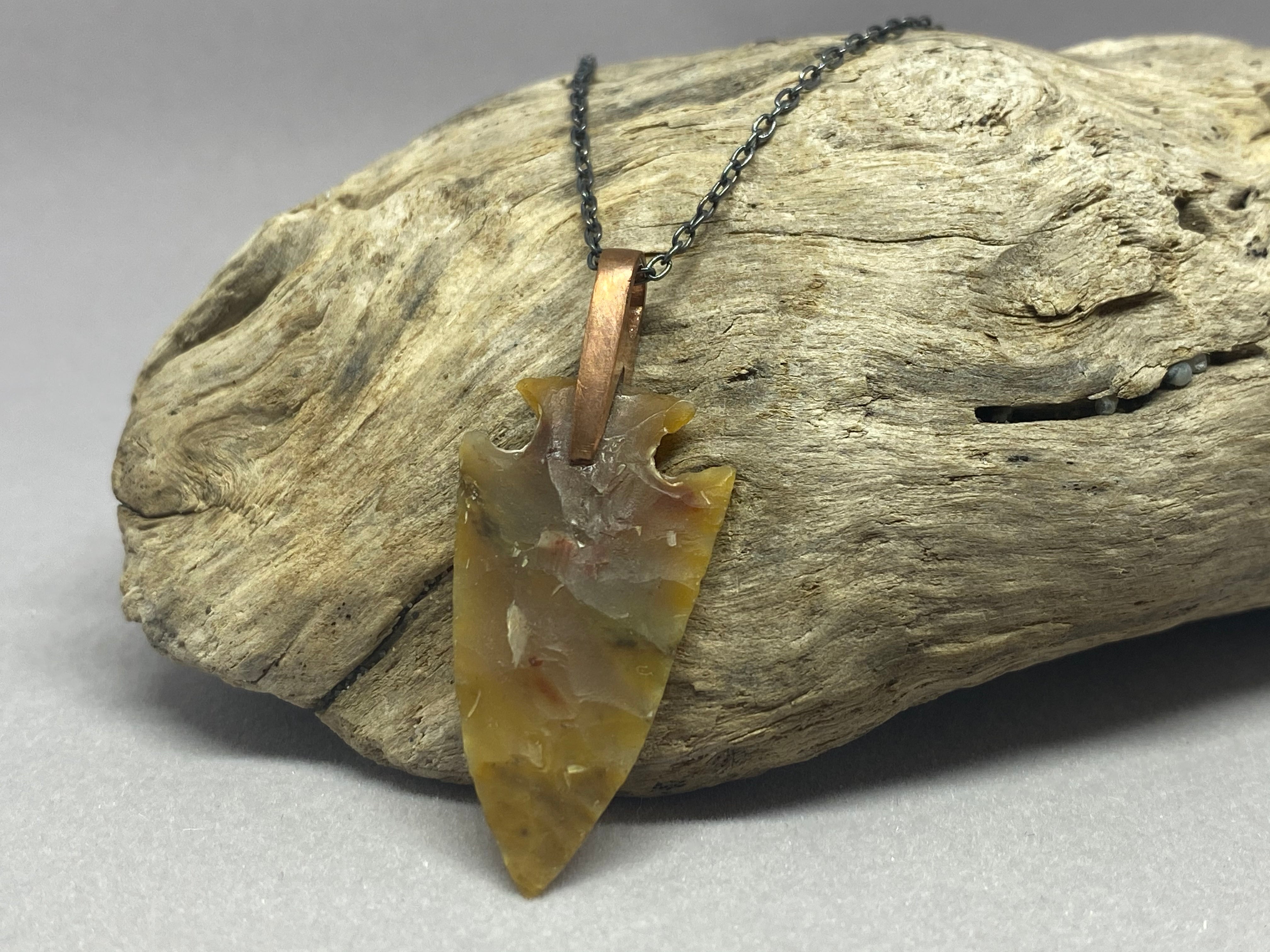 Jake Castor- Petrified Wood Arrowhead Pendant